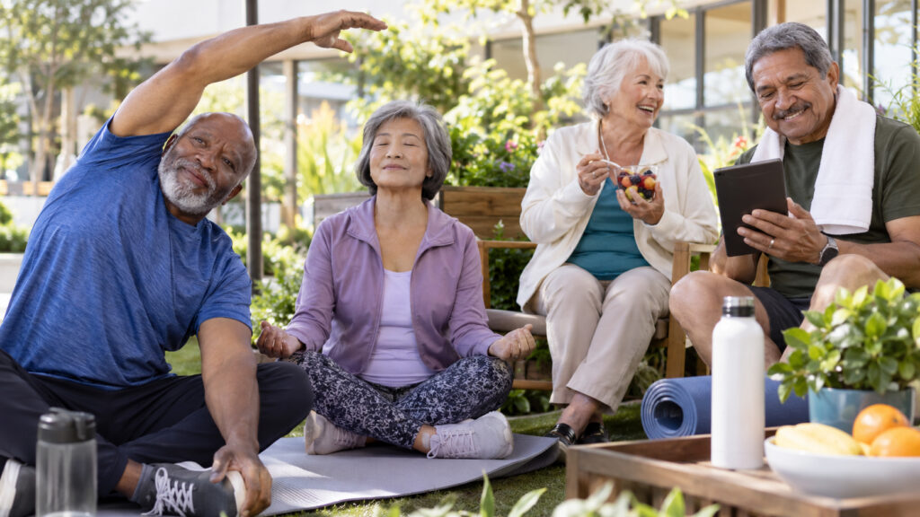 Diverse group of older adults practicing exercise, mindfulness, healthy eating, and using technology